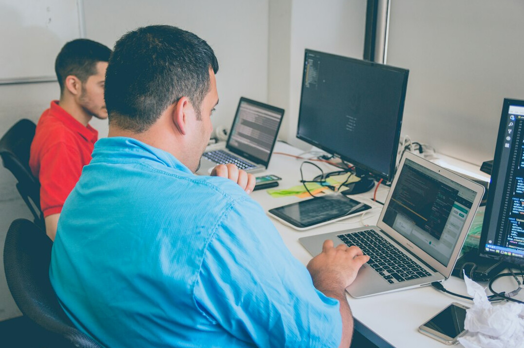 programmers developing insurance software